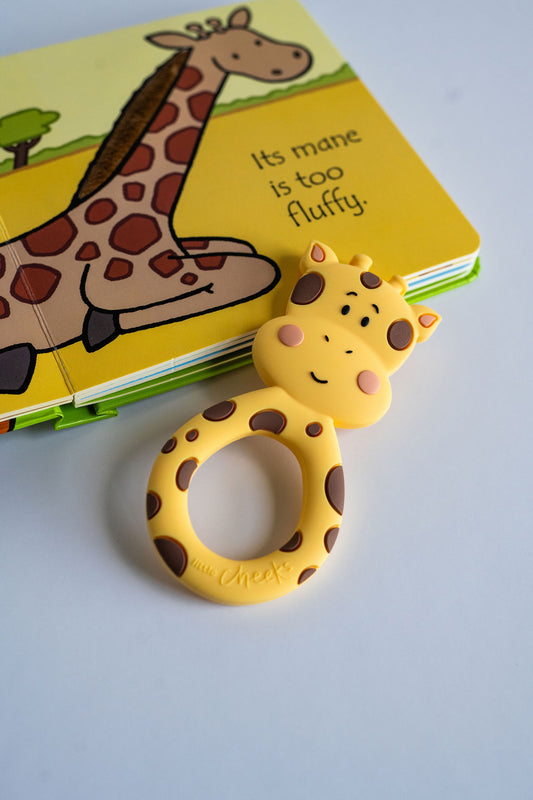 Geraldine the Giraffe teether and "That's not my" book